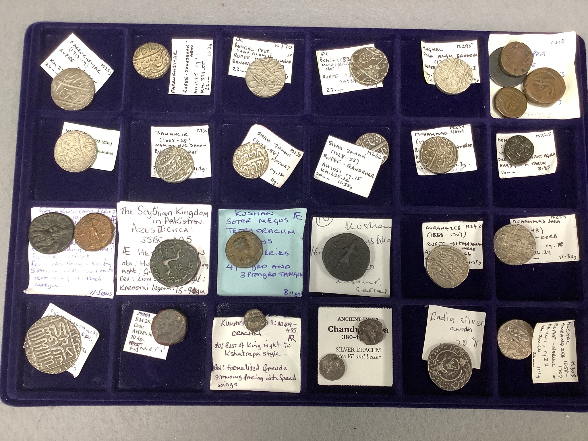 A collection of Indian coins mostly 16th-19th century, and UK silver crowns, half crowns and medals